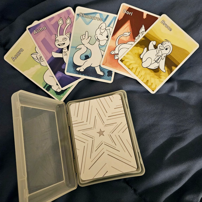 <b>Neopets card deck</b> <hr/> Last year, I made a deck of cards featuring all 52 species of Neopets. You can see the full illustrated collection in a video <a href='https://bsky.app/profile/doomtemp.bsky.social/post/3l5iuowl3nq2b' target='_blank'>on my BlueSky here.</a>